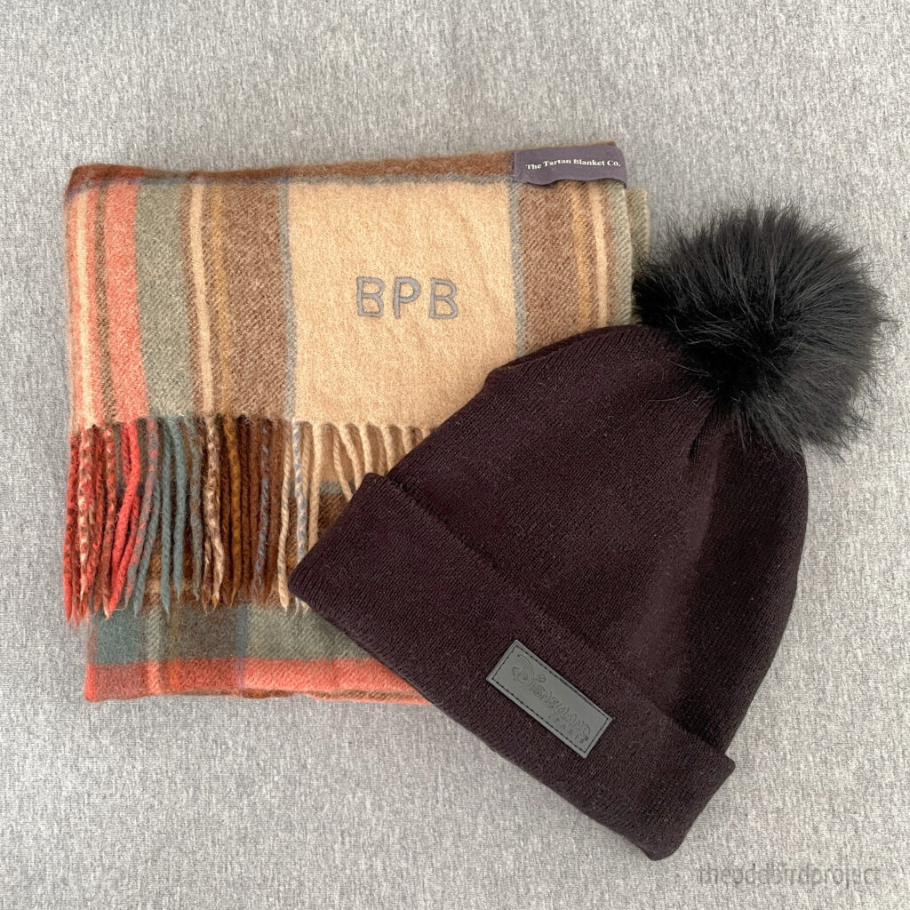 image of winter items, a scarf and beanie hat